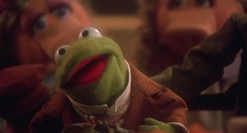 Movie still from “The Muppet Christmas Carol” (1992), directed by Brian Henson – A stuffed animal frog; Extreme Close Up shot, Over the shoulder angle