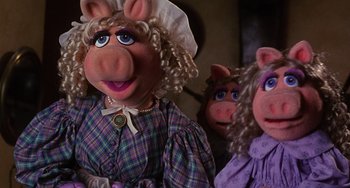 Movie still from “The Muppet Christmas Carol” (1992), directed by Brian Henson – Two dolls of the muppet character miss piggy; Close Up shot, High angle
