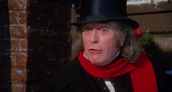Movie still from “The Muppet Christmas Carol” (1992), directed by Brian Henson – A person wearing a top hat; Close Up shot, Low angle
