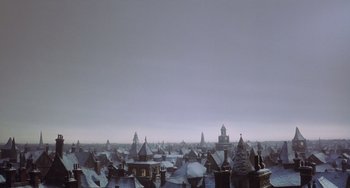 Movie still from “The Muppet Christmas Carol” (1992), directed by Brian Henson – A view of a city from the top of a building; Extreme Wide shot, Low angle