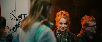 Movie still from “Riders of Justice” (2020), directed by Anders Thomas Jensen – A woman with red hair is looking at another woman; Close Up shot, Over the shoulder angle