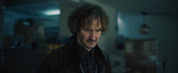 Movie still from “Riders of Justice” (2020), directed by Anders Thomas Jensen – A person wearing a jacket; Close Up shot, Over the shoulder angle