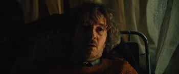 Movie still from “Riders of Justice” (2020), directed by Anders Thomas Jensen – A person wearing a sweater; Close Up shot, High angle