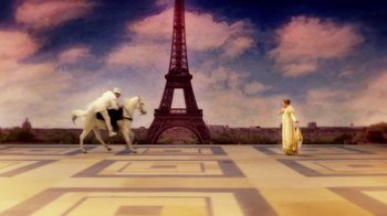 Movie still from “The Muppets” (2011), directed by James Bobin – A painting of a man riding a horse next to an eiffel tower; Extreme Wide shot, High angle