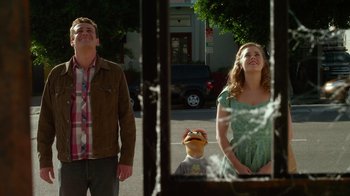 Movie still from “The Muppets” (2011), directed by James Bobin – A man and a woman standing in front of a window; Medium shot, Over the shoulder angle