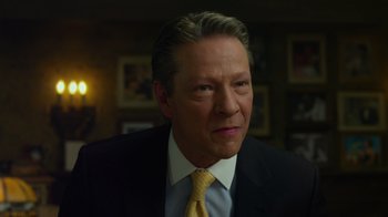 Movie still from “The Muppets” (2011), directed by James Bobin – A person wearing a suit and tie; Close Up shot, Over the shoulder angle