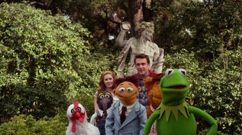 Movie still from “The Muppets” (2011), directed by James Bobin – A group of people standing next to each other in front of a statue; Wide shot, Low angle