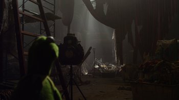 Movie still from “The Muppets” (2011), directed by James Bobin – A room filled with lots of debris and lights in it; Wide shot, Low angle
