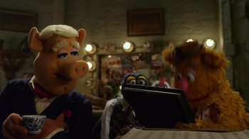 Movie still from “The Muppets” (2011), directed by James Bobin – A couple of stuffed animals sitting in front of a laptop computer; Medium shot, Over the shoulder angle