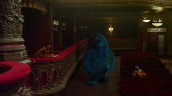 Movie still from “The Muppets” (2011), directed by James Bobin – A stuffed gorilla is standing in a theater; Extreme Wide shot, High angle