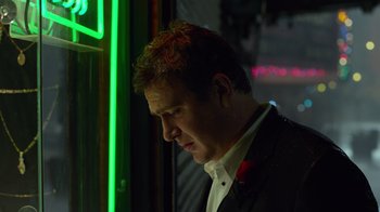 Movie still from “The Muppets” (2011), directed by James Bobin – A person wearing a suit near a window; Close Up shot, Low angle