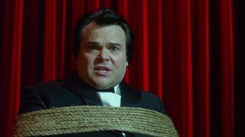 Movie still from “The Muppets” (2011), directed by James Bobin – A man with a rope around his neck and head; Close Up shot, High angle