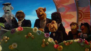 Movie still from “The Muppets” (2011), directed by James Bobin – A group of people dressed up like muppets; Wide shot, Low angle