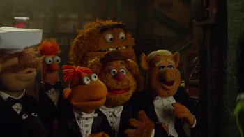 Movie still from “The Muppets” (2011), directed by James Bobin – A group of people dressed up as the muppets; Medium shot, High angle