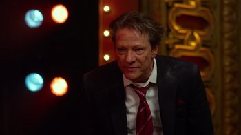 Movie still from “The Muppets” (2011), directed by James Bobin – A person wearing a suit and tie; Close Up shot, High angle