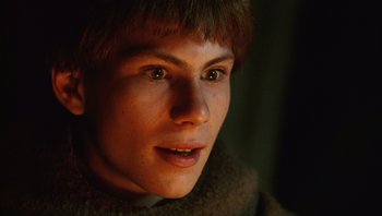 Movie still from “The Name of the Rose” (1986), directed by Jean-Jacques Annaud – A person's face in the dark; Close Up shot, Low angle