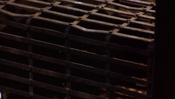 Movie still from “The Name of the Rose” (1986), directed by Jean-Jacques Annaud – View of a metal grate; Extreme Close Up shot, Overhead angle