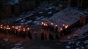 Movie still from “The Name of the Rose” (1986), directed by Jean-Jacques Annaud – A group of people holding torches in the snow; Extreme Wide shot, High angle