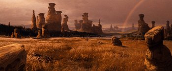 Movie still from “The NeverEnding Story” (1984), directed by Wolfgang Petersen – An image of an image of a desert scene; Extreme Wide shot, Low angle