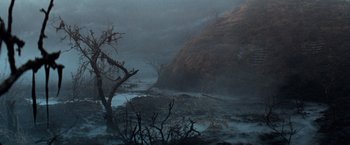 Movie still from “The NeverEnding Story” (1984), directed by Wolfgang Petersen – A tree in the middle of a river in the dark; Extreme Wide shot, High angle