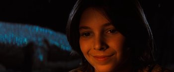 Movie still from “The NeverEnding Story” (1984), directed by Wolfgang Petersen – A woman's face in the dark; Close Up shot, Over the shoulder angle