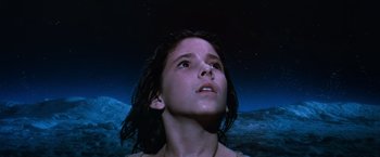 Movie still from “The NeverEnding Story” (1984), directed by Wolfgang Petersen – A young girl looking up into the night sky; Close Up shot, Low angle