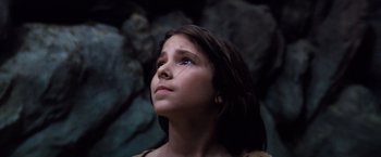 Movie still from “The NeverEnding Story” (1984), directed by Wolfgang Petersen – A young girl looking up into the sky; Close Up shot, Low angle