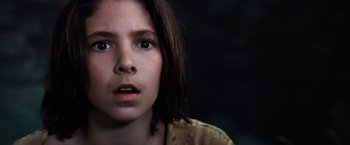 Movie still from “The NeverEnding Story” (1984), directed by Wolfgang Petersen – A young person with a surprised look on their face; Close Up shot, Low angle