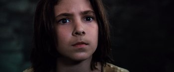 Movie still from “The NeverEnding Story” (1984), directed by Wolfgang Petersen – A young girl's face with blue eyes; Close Up shot, Low angle