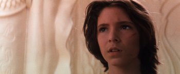Movie still from “The NeverEnding Story” (1984), directed by Wolfgang Petersen – A person with short brown hair; Close Up shot, Low angle