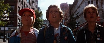 Movie still from “The NeverEnding Story” (1984), directed by Wolfgang Petersen – A young boy is looking up at the sky; Close Up shot, Low angle