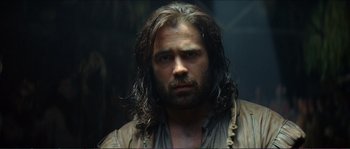 Movie still from “The New World” (2005), directed by Terrence Malick – A man with long hair and a beard is staring straight ahead; Close Up shot, Low angle
