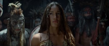 Movie still from “The New World” (2005), directed by Terrence Malick – A woman with long brown hair standing in front of a group of people; Close Up shot, Low angle
