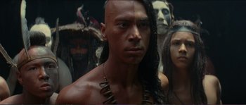 Movie still from “The New World” (2005), directed by Terrence Malick – A person wearing a long necklace; Close Up shot, Low angle