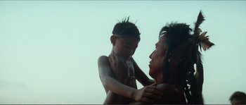 Movie still from “The New World” (2005), directed by Terrence Malick – A man and a boy are looking at each other; Close Up shot, Over the shoulder angle