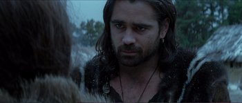 Movie still from “The New World” (2005), directed by Terrence Malick – A person with long hair and a beard; Close Up shot, Over the shoulder angle