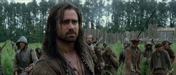 Movie still from “The New World” (2005), directed by Terrence Malick – A group of men standing next to each other in a field; Close Up shot, Over the shoulder angle