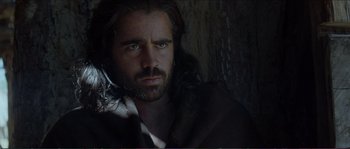 Movie still from “The New World” (2005), directed by Terrence Malick – A man with long hair and a beard is looking at the camera; Close Up shot, Low angle