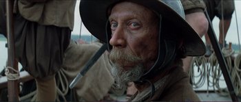 Movie still from “The New World” (2005), directed by Terrence Malick – An old man with a long beard wearing a hat; Close Up shot, Low angle