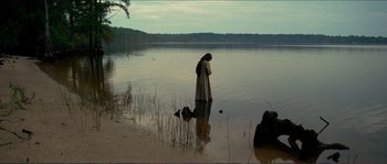 Movie still from “The New World” (2005), directed by Terrence Malick – A woman standing in a body of water; Extreme Wide shot, High angle