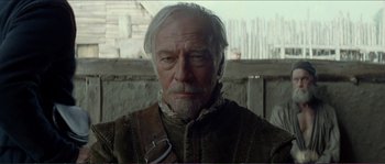 Movie still from “The New World” (2005), directed by Terrence Malick – An older man with a beard and a mustache; Close Up shot, Over the shoulder angle