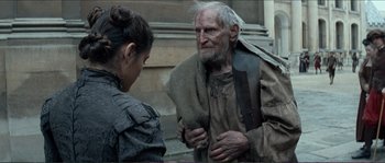 Movie still from “The New World” (2005), directed by Terrence Malick – An old man and a young woman are talking; Medium shot, Over the shoulder angle