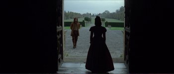 Movie still from “The New World” (2005), directed by Terrence Malick – A man and a woman are standing in front of each other; Wide shot, Over the shoulder angle