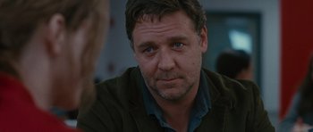 Movie still from “The Next Three Days” (2010), directed by Paul Haggis – A person wearing a jacket; Close Up shot, Over the shoulder angle