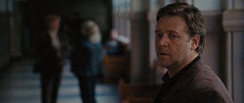 Movie still from “The Next Three Days” (2010), directed by Paul Haggis – A person in a black shirt; Close Up shot, Over the shoulder angle