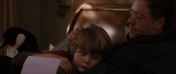Movie still from “The Next Three Days” (2010), directed by Paul Haggis – A child laying in a bed with his head on a pillow; Close Up shot, Over the shoulder angle