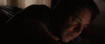Movie still from “The Next Three Days” (2010), directed by Paul Haggis – A man's face in the dark; Close Up shot, Over the shoulder angle