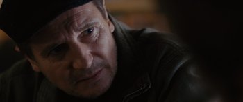 Movie still from “The Next Three Days” (2010), directed by Paul Haggis – A man's face in a dark room; Close Up shot, Over the shoulder angle