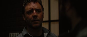 Movie still from “The Next Three Days” (2010), directed by Paul Haggis – A person wearing a black shirt; Close Up shot, Over the shoulder angle