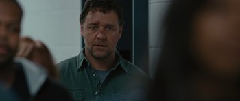 Movie still from “The Next Three Days” (2010), directed by Paul Haggis – A person wearing a green shirt; Close Up shot, Over the shoulder angle